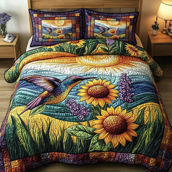 Floral Hummingbird quilted 3-piece bedding set on a made bed with two matching pillow shams