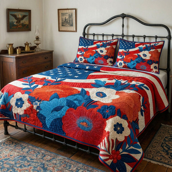Floral Independence quilted 3-piece bedding set on a made bed in a warmly lit bedroom