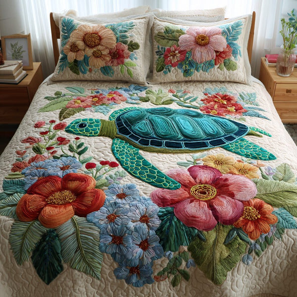 Floral Lagoon quilted 3-piece bedding set on a made bed in a light coastal bedroom