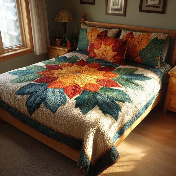 Floral Leaf Burst quilted 3-piece bedding set on a made bed with two matching pillow shams