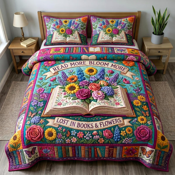 Floral Library quilted 3-piece bedding set on a made bed with two matching pillow shams