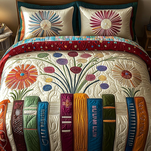 Floral Library quilted 3-piece bedding set on a made bed with two matching pillow shams