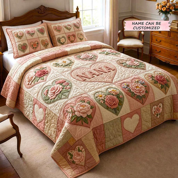 Floral Love 3-Piece Quilted Bedding Set - Design 1 quilted 3-piece bedding set on a made bed with two matching pillow shams