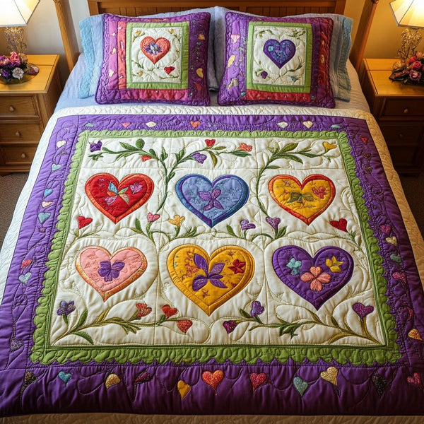 Floral Love Hearts quilted 3-piece bedding set on a made bed with two matching pillow shams