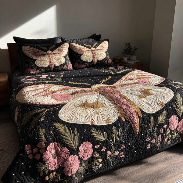 Floral Moth quilted 3-piece bedding set on a made bed with two matching pillow shams