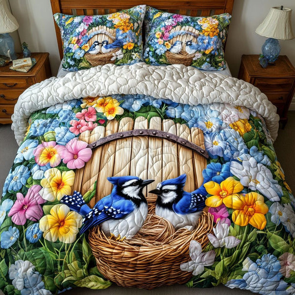 Floral Nesting quilted 3-piece bedding set on a made bed with two matching pillow shams