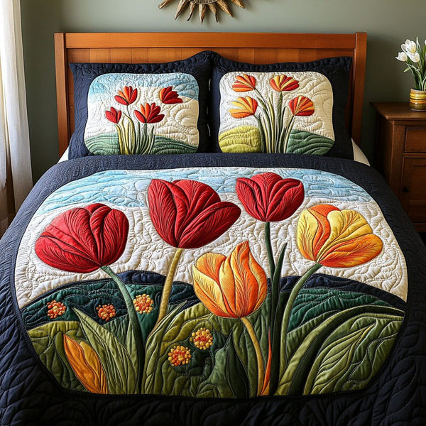 Floral Rebirth quilted 3-piece bedding set on a made bed with two matching pillow shams