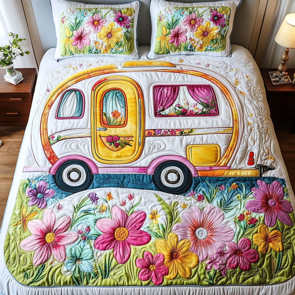 Floral Roadtrip quilted 3-piece bedding set on a made bed with two matching pillow shams