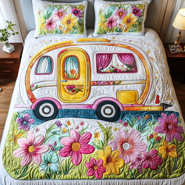 Floral Roadtrip quilted 3-piece bedding set on a made bed with two matching pillow shams