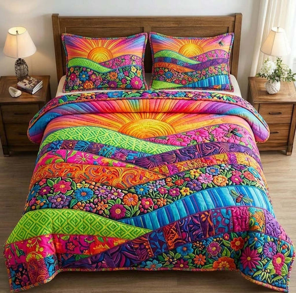 Floral Sunburst quilted 3-piece bedding set on a made bed with two matching pillow shams