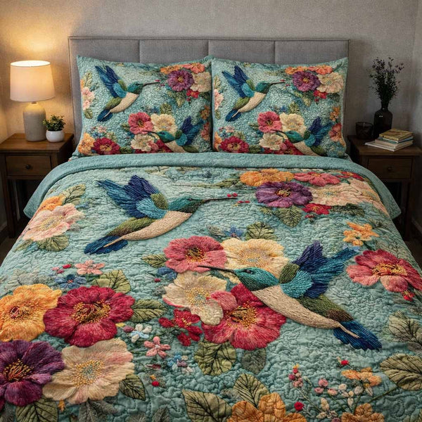 Floral Symphony quilted 3-piece bedding set on a made bed with two matching pillow shams