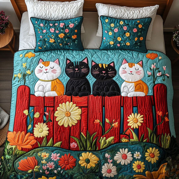 Floral Trio Cats quilted 3-piece bedding set on a made bed with two matching pillow shams
