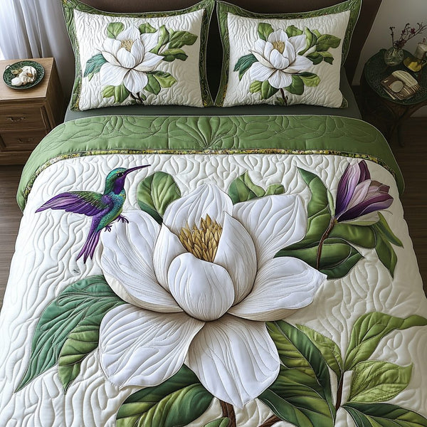Floral Whisper quilted 3-piece bedding set on a made bed with two matching pillow shams