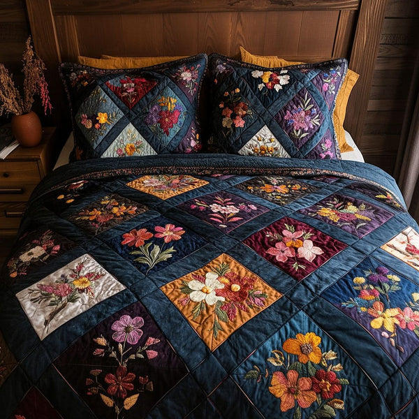 Floral Whispers quilted 3-piece bedding set on a made bed with two matching pillow shams