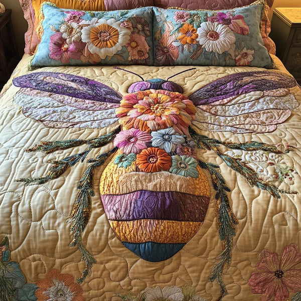 Floral Wings quilted 3-piece bedding set on a made bed with two matching pillow shams