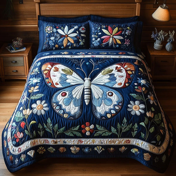 Flower Essence quilted 3-piece bedding set on a made bed with two matching pillow shams