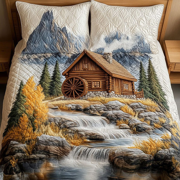 Flowing Grace quilted 3-piece bedding set on a made bed with two matching pillow shams