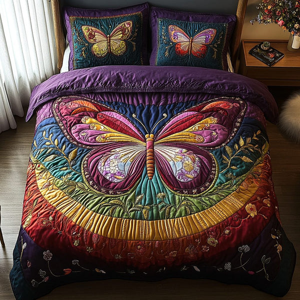 Flutter and Grace quilted 3-piece bedding set on a made bed with two matching pillow shams