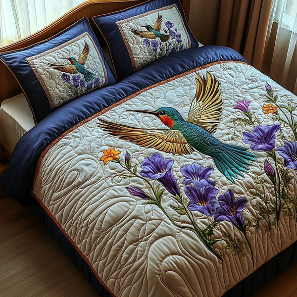 Flutter Bloom quilted 3-piece bedding set on a made bed with two matching pillow shams