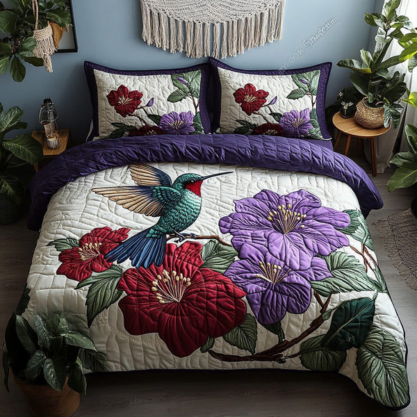 Flutter Garden quilted 3-piece bedding set on a made bed with two matching pillow shams