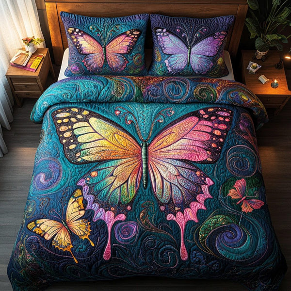 Flutter Grace quilted 3-piece bedding set on a made bed with two matching pillow shams