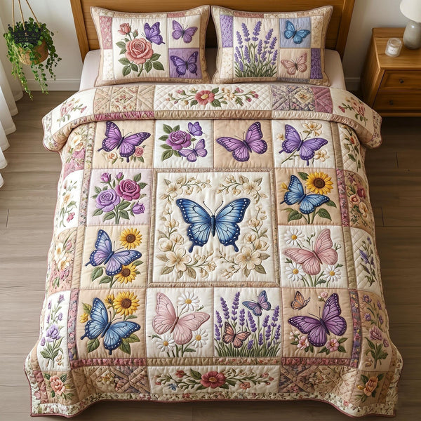 Flutter Wings quilted 3-piece bedding set on a made bed with two matching pillow shams