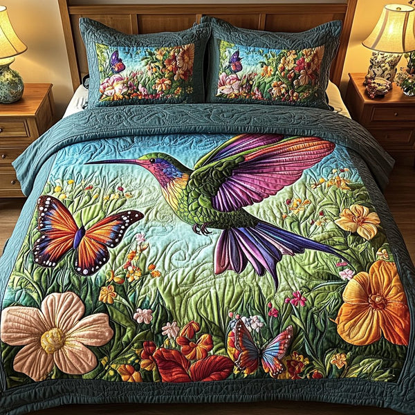 Flutter Wings quilted 3-piece bedding set on a made bed with two matching pillow shams