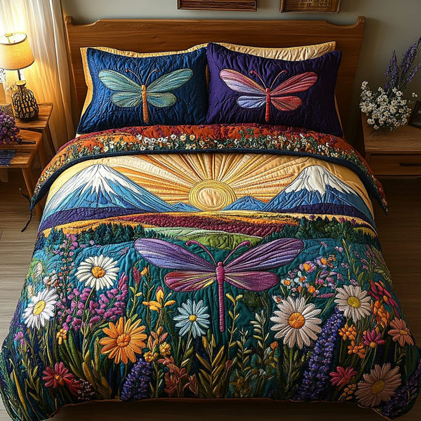 Fluttering Beauty quilted 3-piece bedding set on a made bed with two matching pillow shams