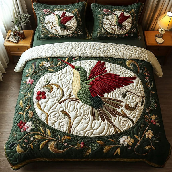 Fluttering Beauty quilted 3-piece bedding set on a made bed with two matching pillow shams