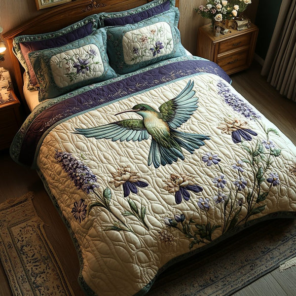 Fluttering Elegance quilted 3-piece bedding set on a made bed with two matching pillow shams