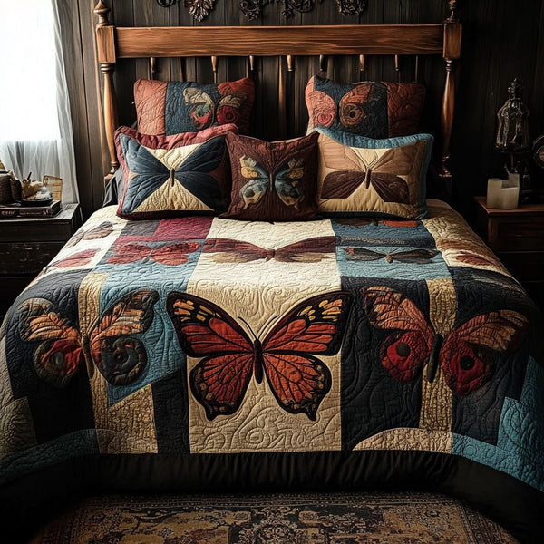 Fluttering Fantasy quilted 3-piece bedding set on a made bed with two matching pillow shams