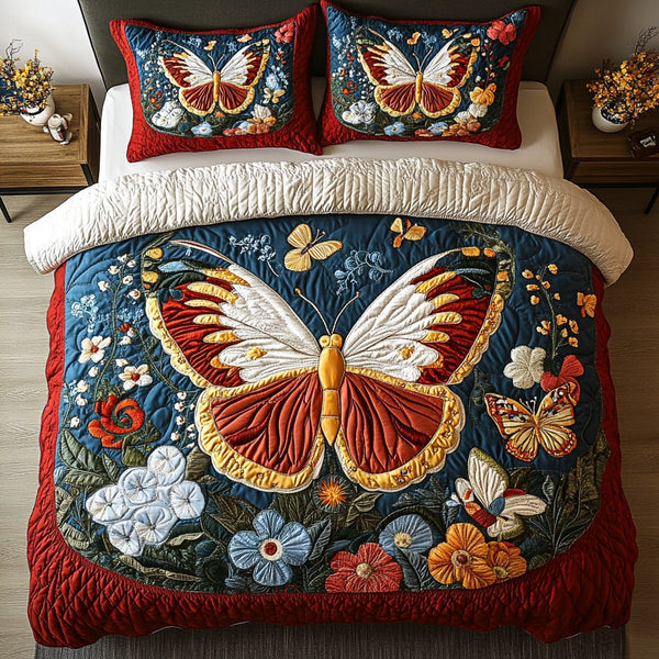 Fluttering Grace quilted 3-piece bedding set on a made bed with two matching pillow shams