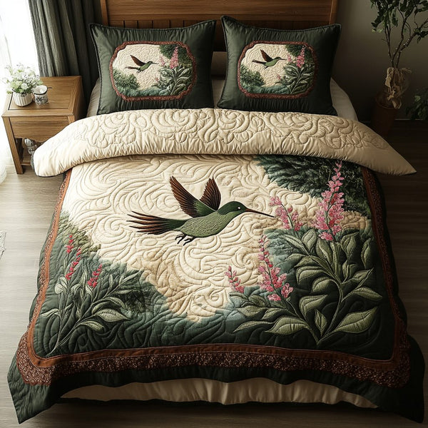 Fluttering Grace quilted 3-piece bedding set on a made bed with two matching pillow shams