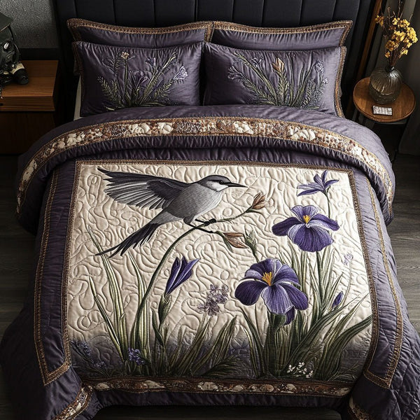 Fluttering Iris quilted 3-piece bedding set on a made bed with two matching pillow shams