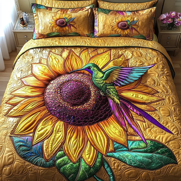 Flying Fantasy quilted 3-piece bedding set on a made bed with two matching pillow shams