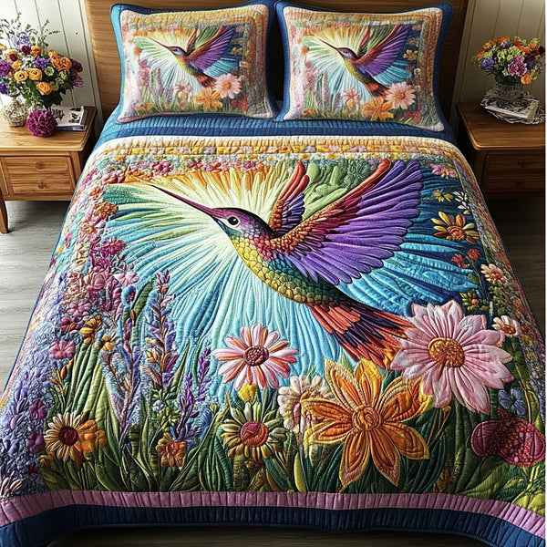 Flying Serenity quilted 3-piece bedding set on a made bed with two matching pillow shams