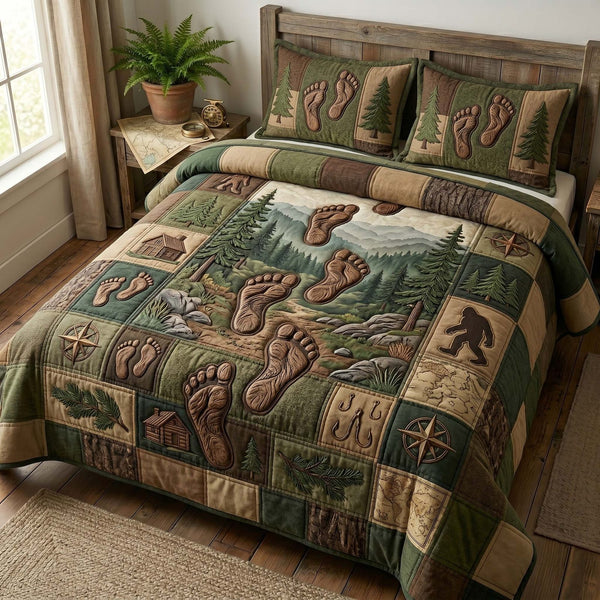 Footprint Trail quilted 3-piece bedding set on a made bed with two matching pillow shams