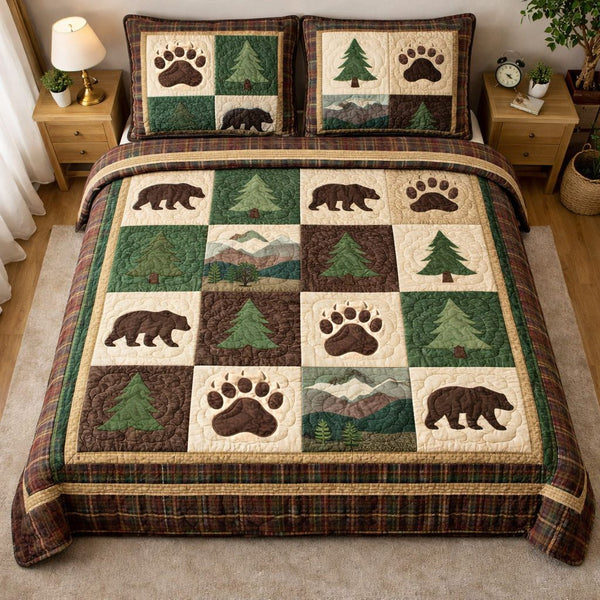 Forest Paw Trail quilted 3-piece bedding set on a made bed with two matching pillow shams