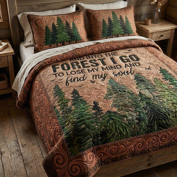Forest Serenity quilted 3-piece bedding set on a made bed with two matching pillow shams