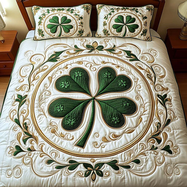 Four Leaf Bliss quilted 3-piece bedding set on a made bed with two matching pillow shams