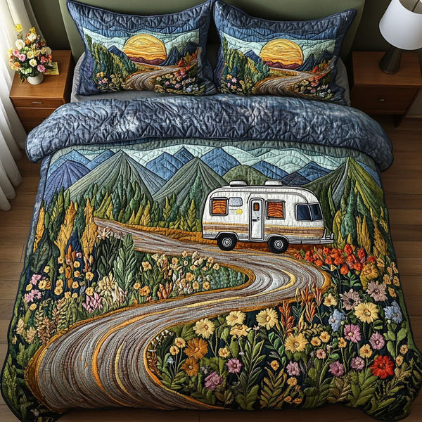 Free Spirit quilted 3-piece bedding set on a made bed with two matching pillow shams