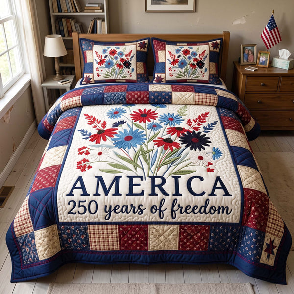 Freedom Bouquet quilted 3-piece bedding set on a made bed in a warmly lit bedroom