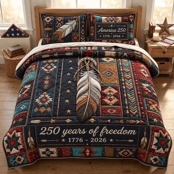 Freedom Feather Legacy quilted 3-piece bedding set on a made bed in a warmly lit bedroom