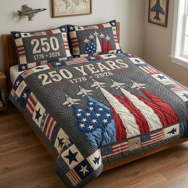 Freedom Flight quilted 3-piece bedding set on a made bed in a warmly lit bedroom