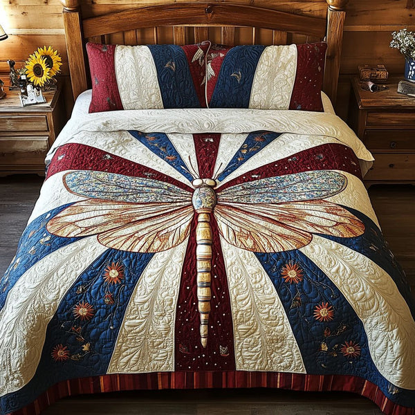 Freedom Flyer quilted 3-piece bedding set on a made bed in a warmly lit bedroom