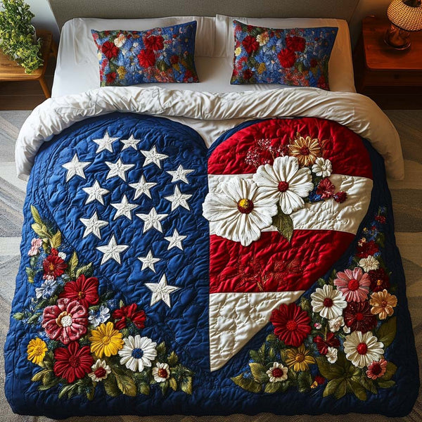 Freedom Heart quilted 3-piece bedding set on a made bed in a warmly lit bedroom