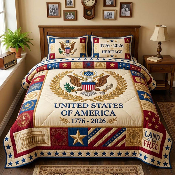 Freedom Heritage quilted 3-piece bedding set on a made bed in a warmly lit bedroom