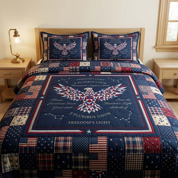 Freedom Patchwork quilted 3-piece bedding set on a made bed in a warmly lit bedroom