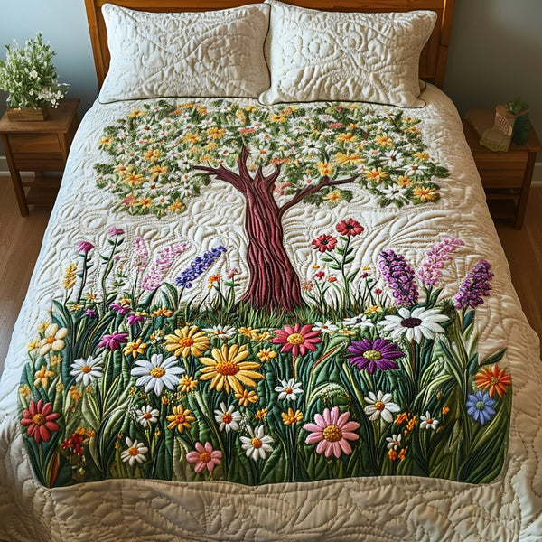 Fresh Bloom quilted 3-piece bedding set on a made bed with two matching pillow shams