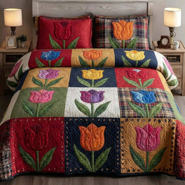 Fresh Blossoms quilted 3-piece bedding set on a made bed with two matching pillow shams